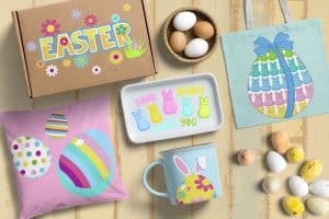 Tabletop decorated with Easter decorations: cardboard box, coffee cup, tray, canvas bag, pillow, colorful eggs.